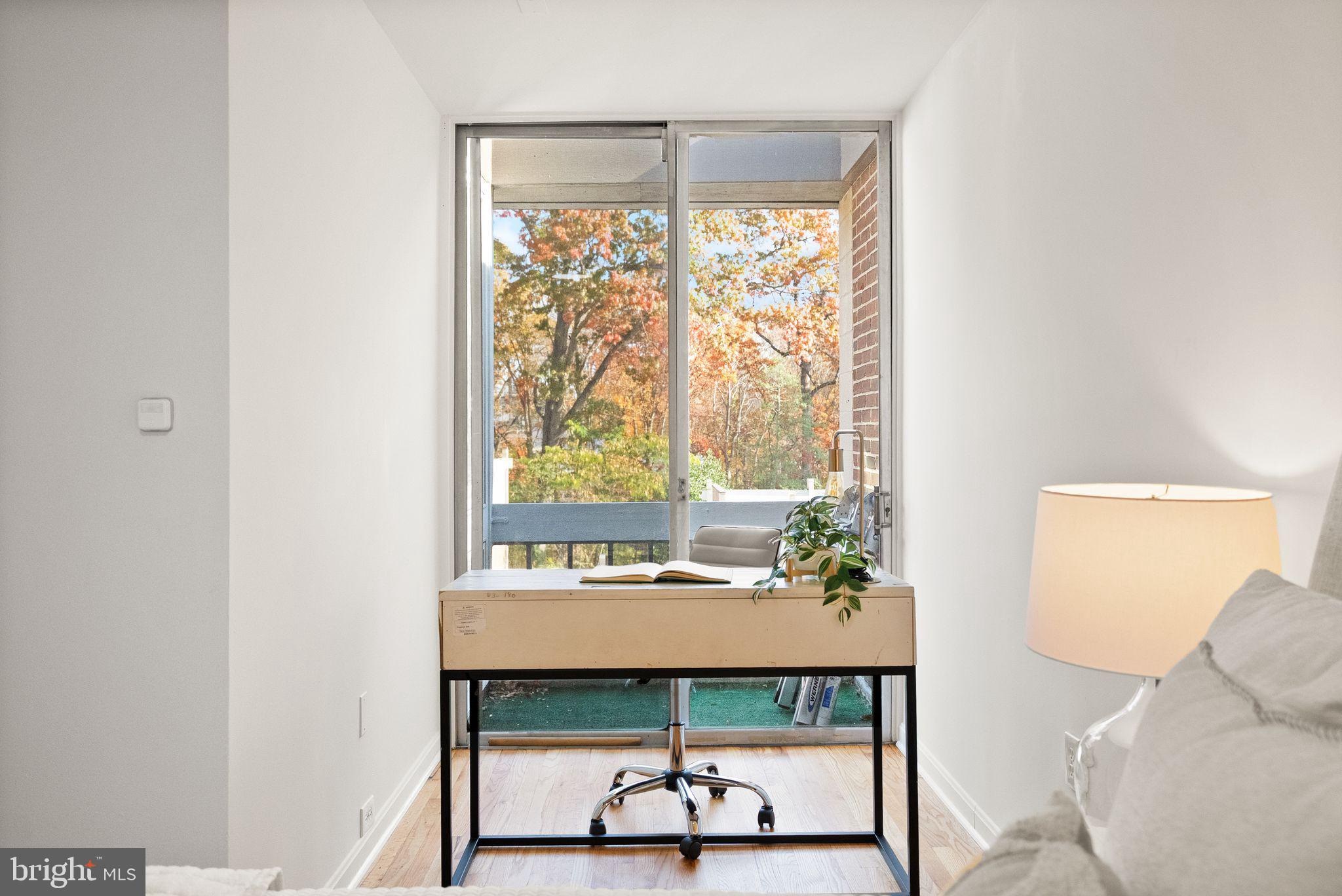 11577 Maple Ridge Road Reston, VA 20190 - Photo 36 of 48 a living room with a table and a window