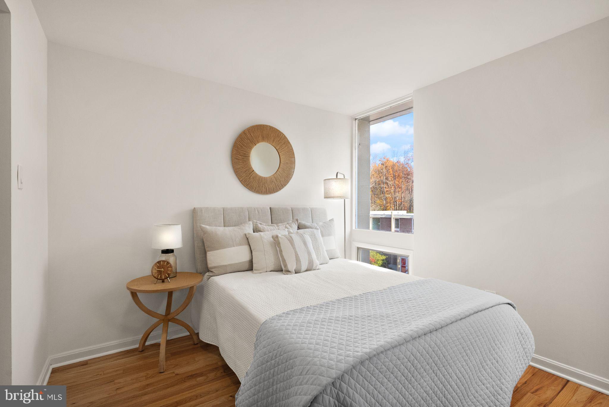 11577 Maple Ridge Road Reston, VA 20190 - Photo 37 of 48 a bedroom with a bed and a window