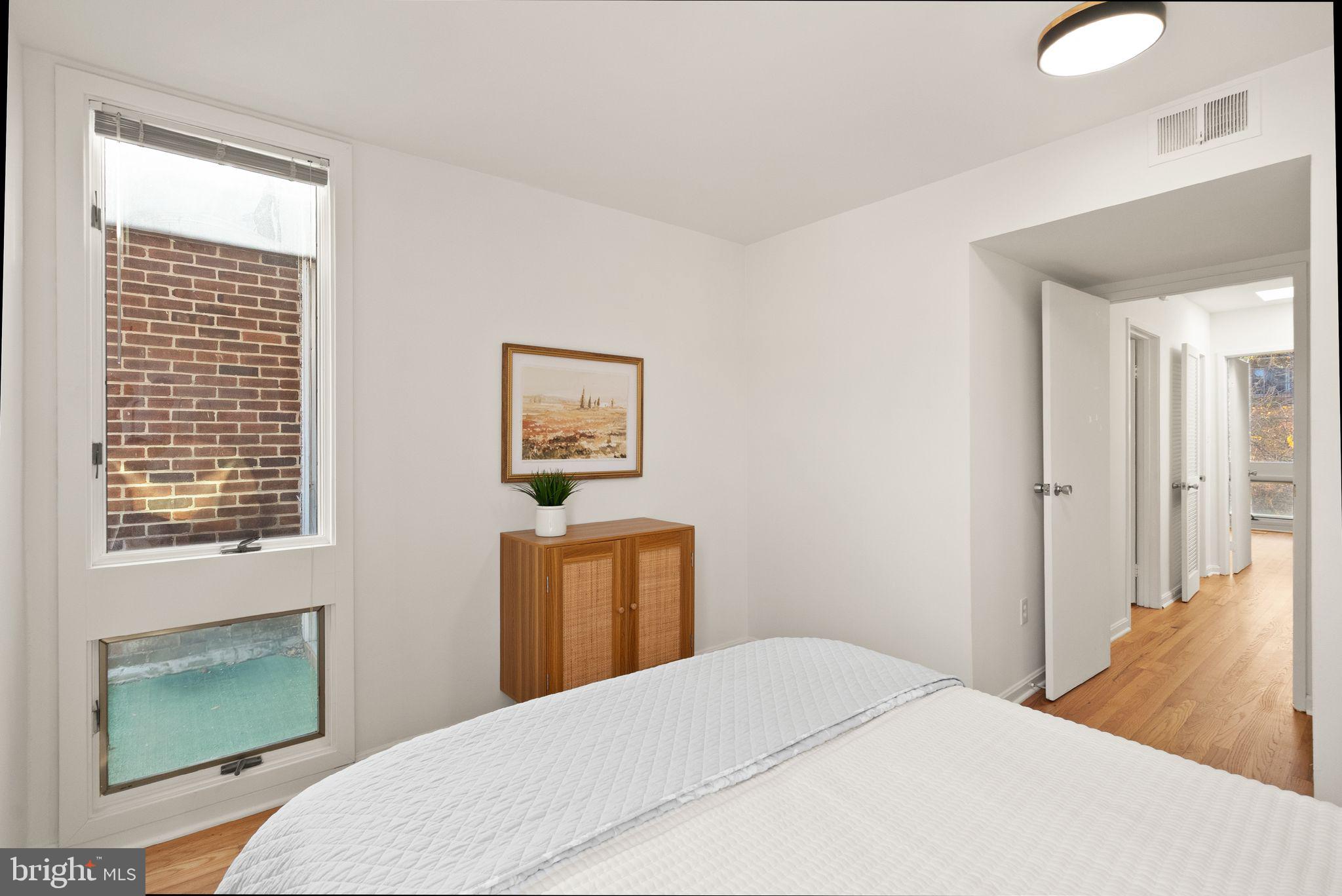 11577 Maple Ridge Road Reston, VA 20190 - Photo 39 of 48 a bedroom with a bed and a window