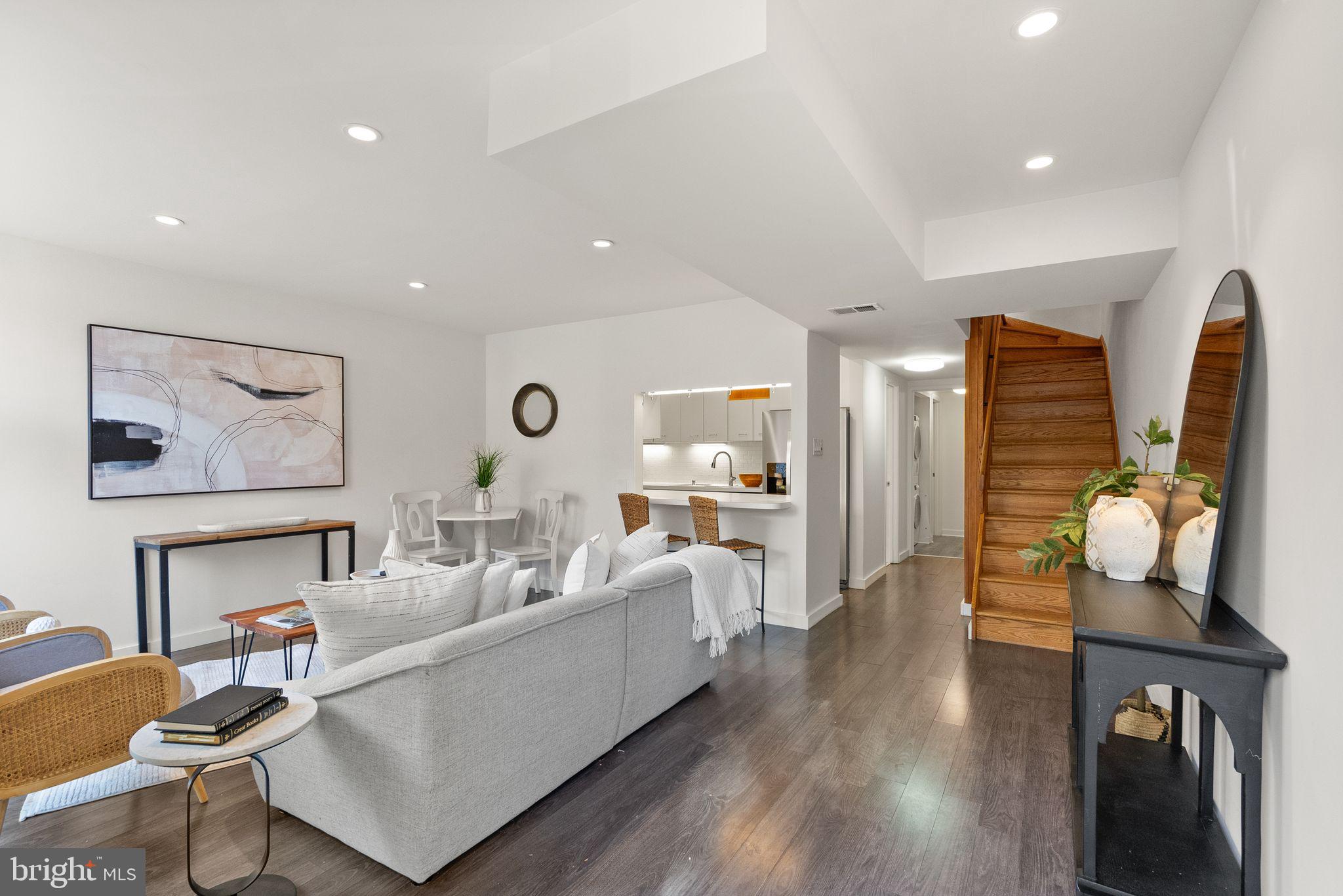 11577 Maple Ridge Road Reston, VA 20190 - Photo 4 of 48 a living room with furniture a rug and white walls