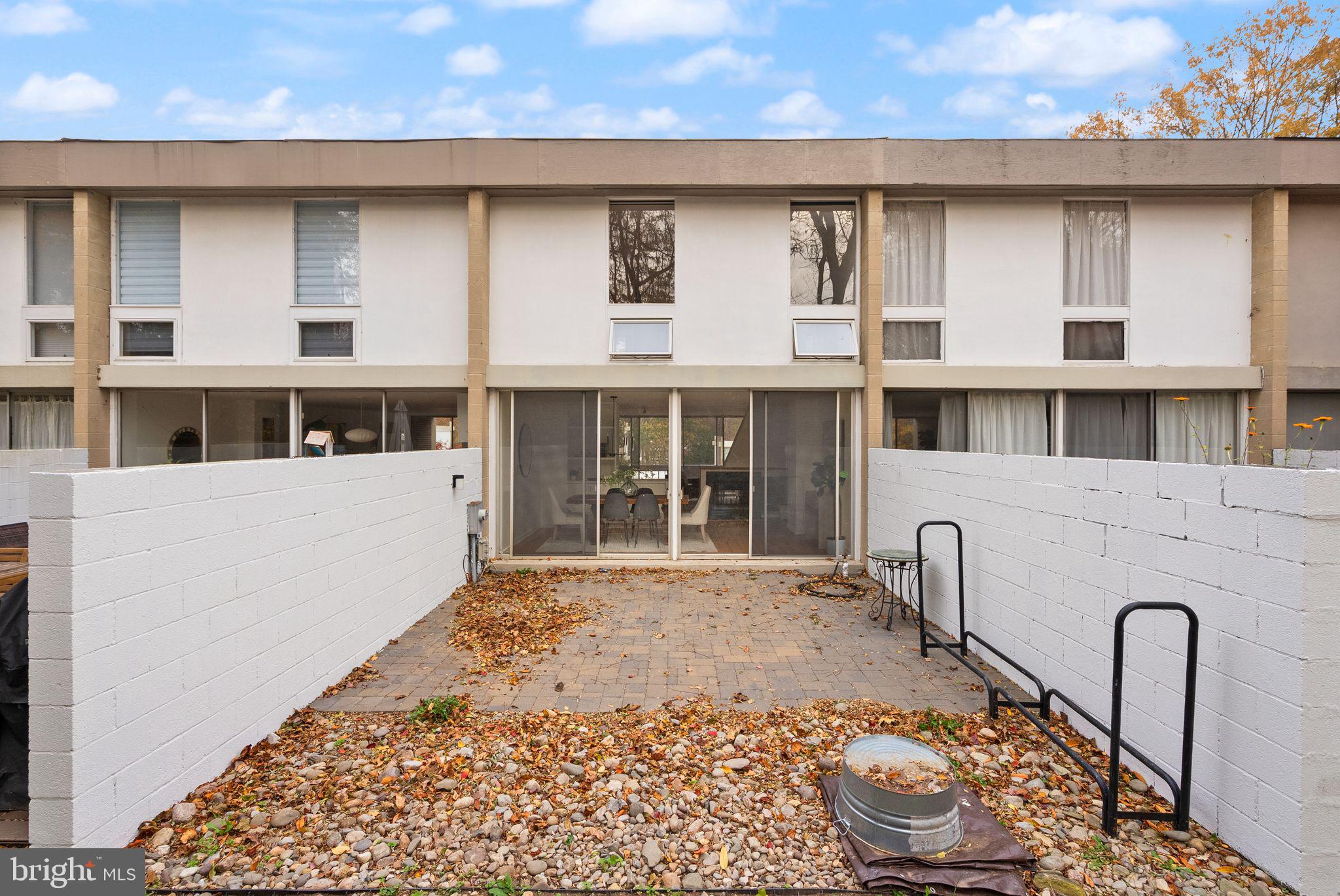 11577 Maple Ridge Road Reston, VA 20190 - Photo 46 of 48 a front view of a house with a garden