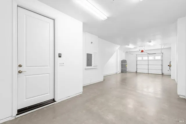 an empty room with a empty space and windows