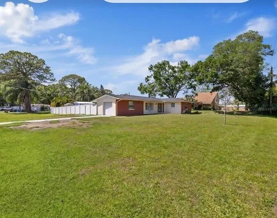 a view of a house with a big yard
