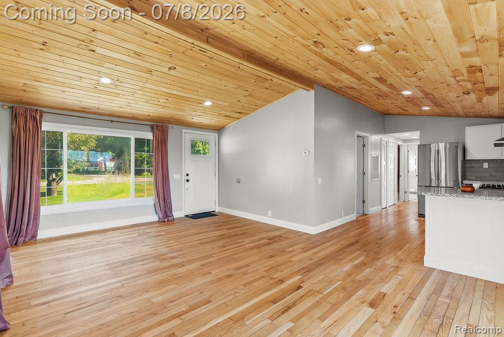 5698 McGrandy Road Bridgeport, MI 48722 - Photo 11 of 26 Open concept living area featuring wood-finish flooring and a vaulted wood-plank ceiling with recessed lighting