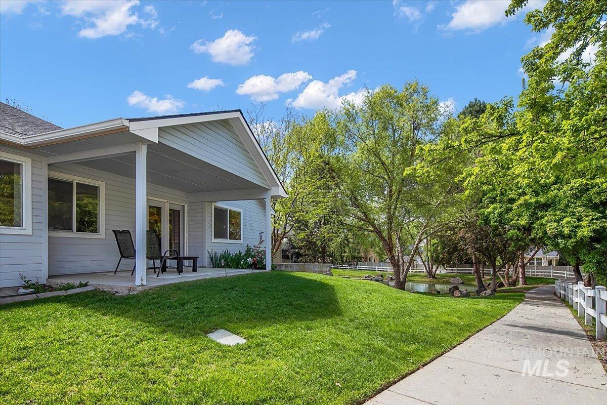 725 North Eagle Road Eagle, ID 83616 - Photo 4 of 45 Covered patio with light blue siding and white trim