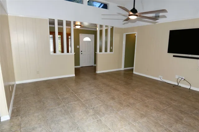 a kitchen with stainless steel appliances wooden cabinets and a stove