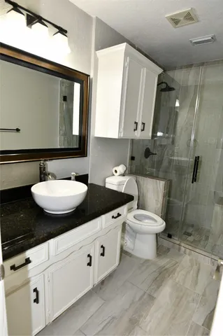 a view of a backyard with table and chairs under an umbrella