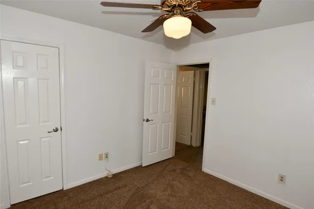 a view of a backyard with garden and plants