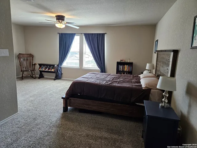 a bedroom with bed and a window