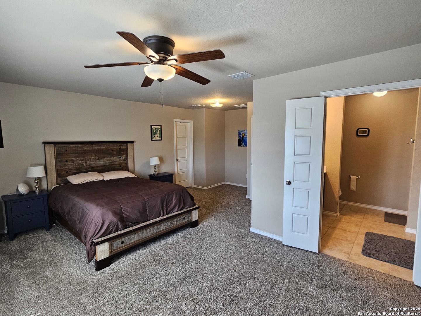 148 Hunters Spring San Antonio, TX 78253 - Photo 12 of 16 a bedroom with a bed and window