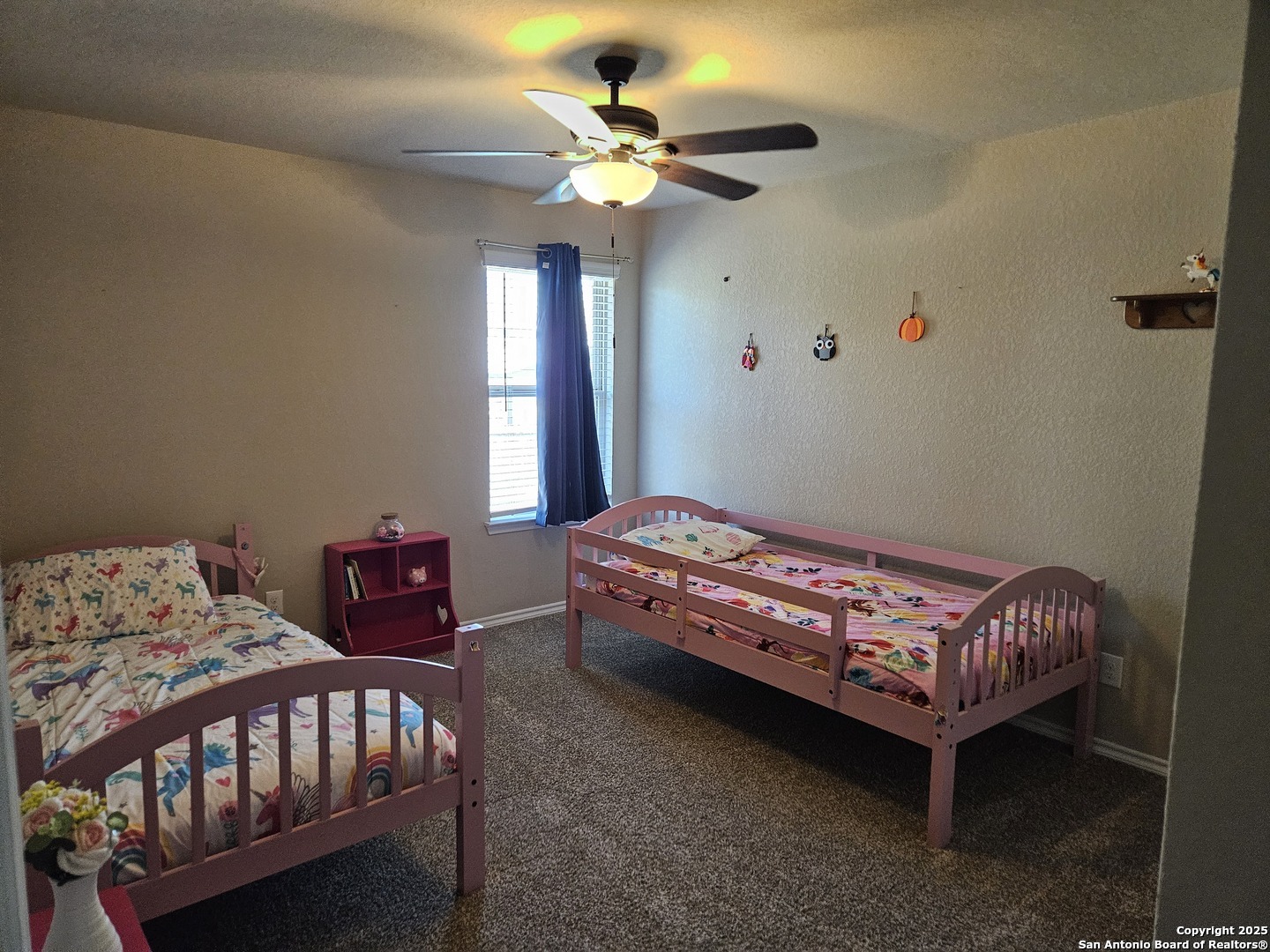 148 Hunters Spring San Antonio, TX 78253 - Photo 13 of 16 a bedroom with a bed a chandelier and a dresser