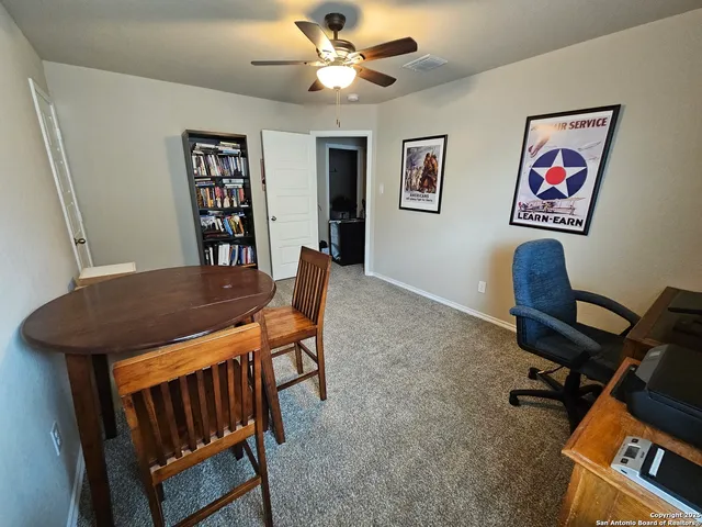 a view of a workspace with furniture