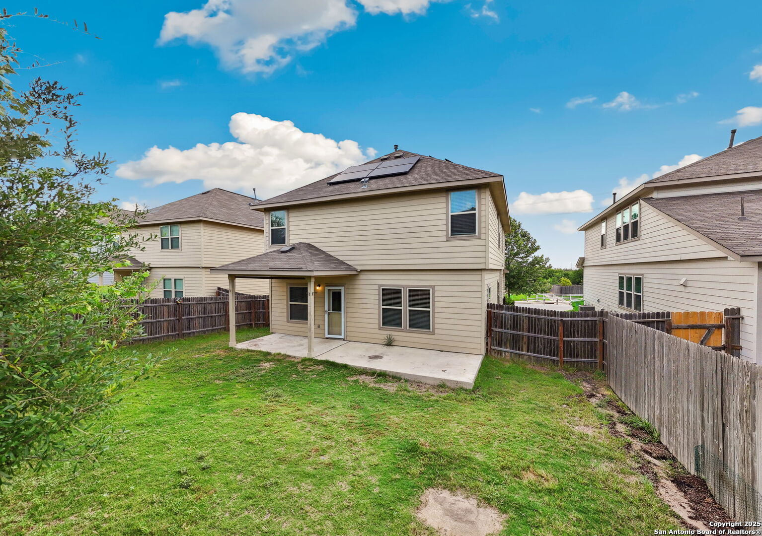 148 Hunters Spring San Antonio, TX 78253 - Photo 16 of 16 a view of a house with wooden deck and a yard