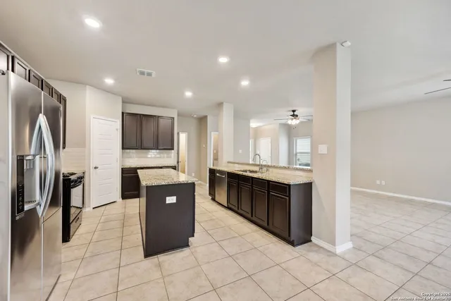 a large bathroom with a large tub and sink