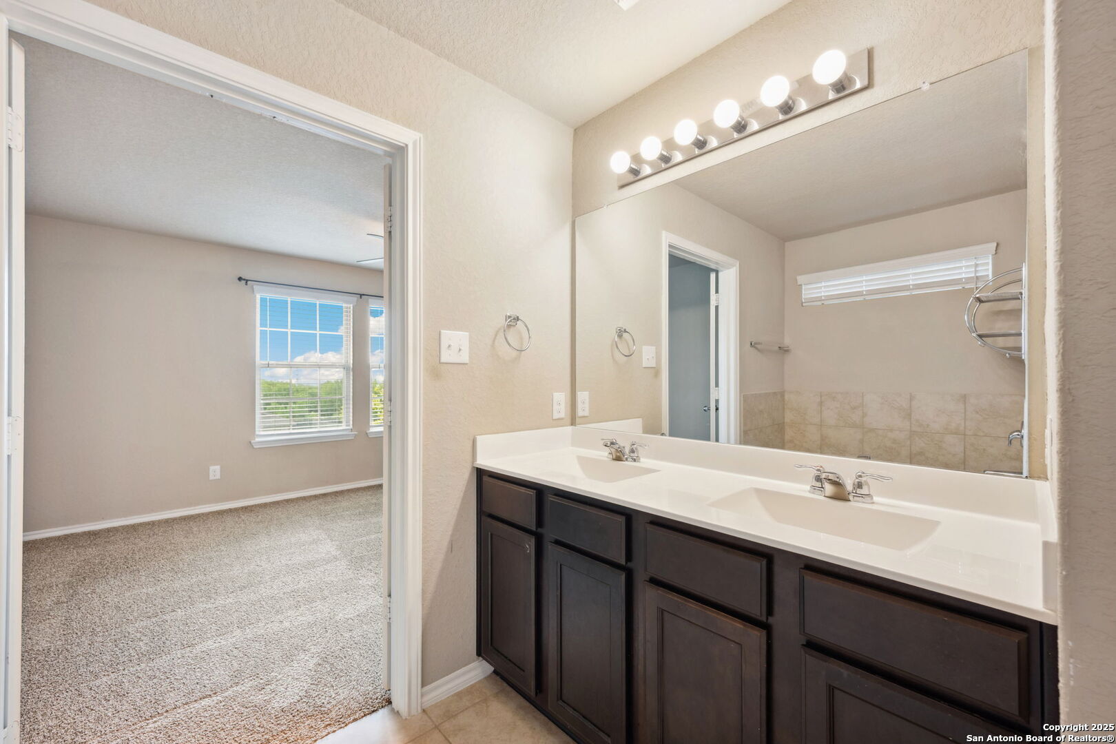 148 Hunters Spring San Antonio, TX 78253 - Photo 8 of 16 a bathroom with a sink double vanity and a mirror