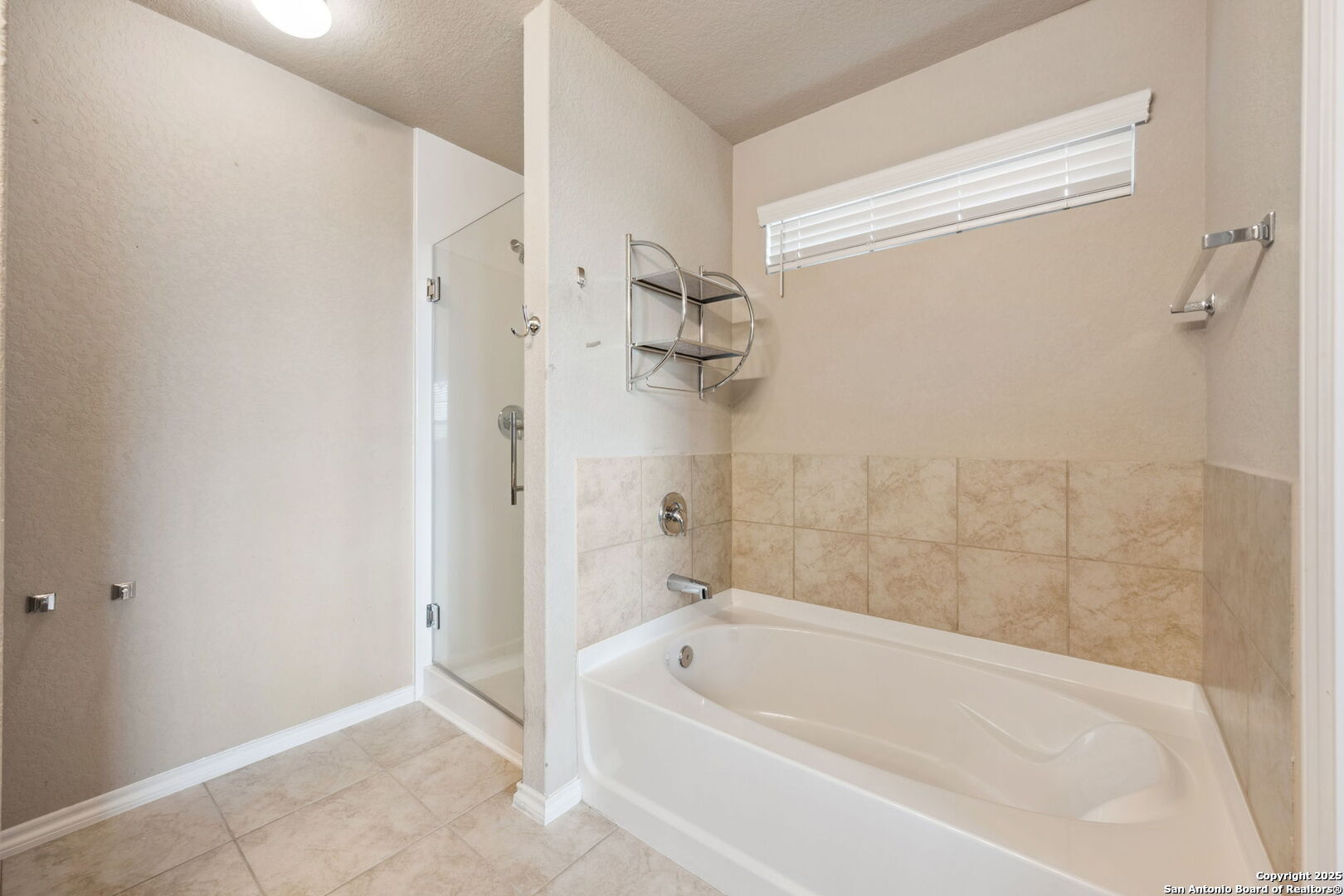 148 Hunters Spring San Antonio, TX 78253 - Photo 9 of 16 a white bath tub sitting next to a shower