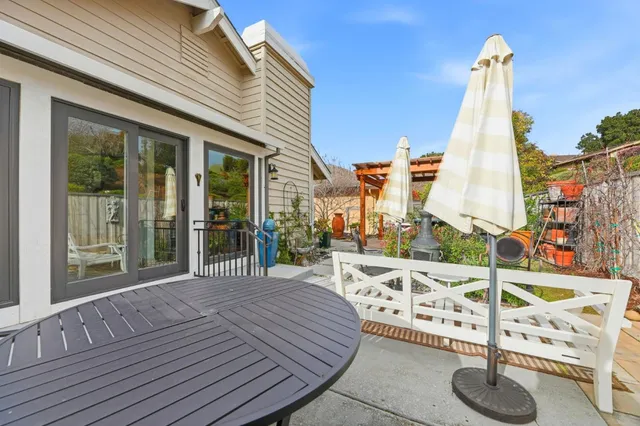 a view of a balcony with furniture