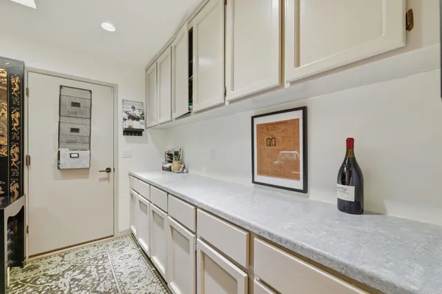 a hallway with cabinets