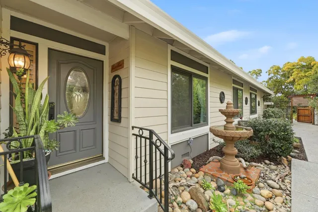 a front view of a house with garden