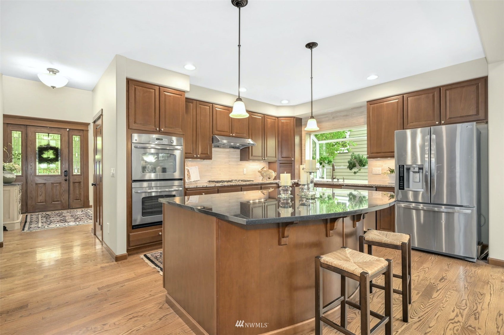 22722 16th Avenue West Bothell, WA 98021 - Photo 11 of 39 a kitchen with kitchen island a counter top space appliances and cabinets