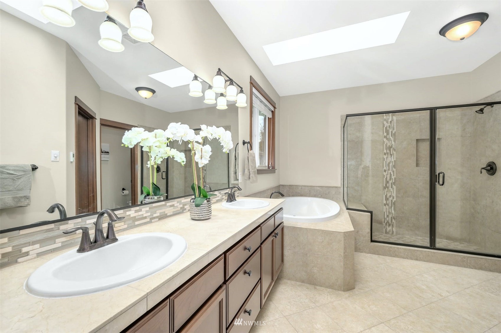 22722 16th Avenue West Bothell, WA 98021 - Photo 16 of 39 a bathroom with a double vanity sink mirror and shower