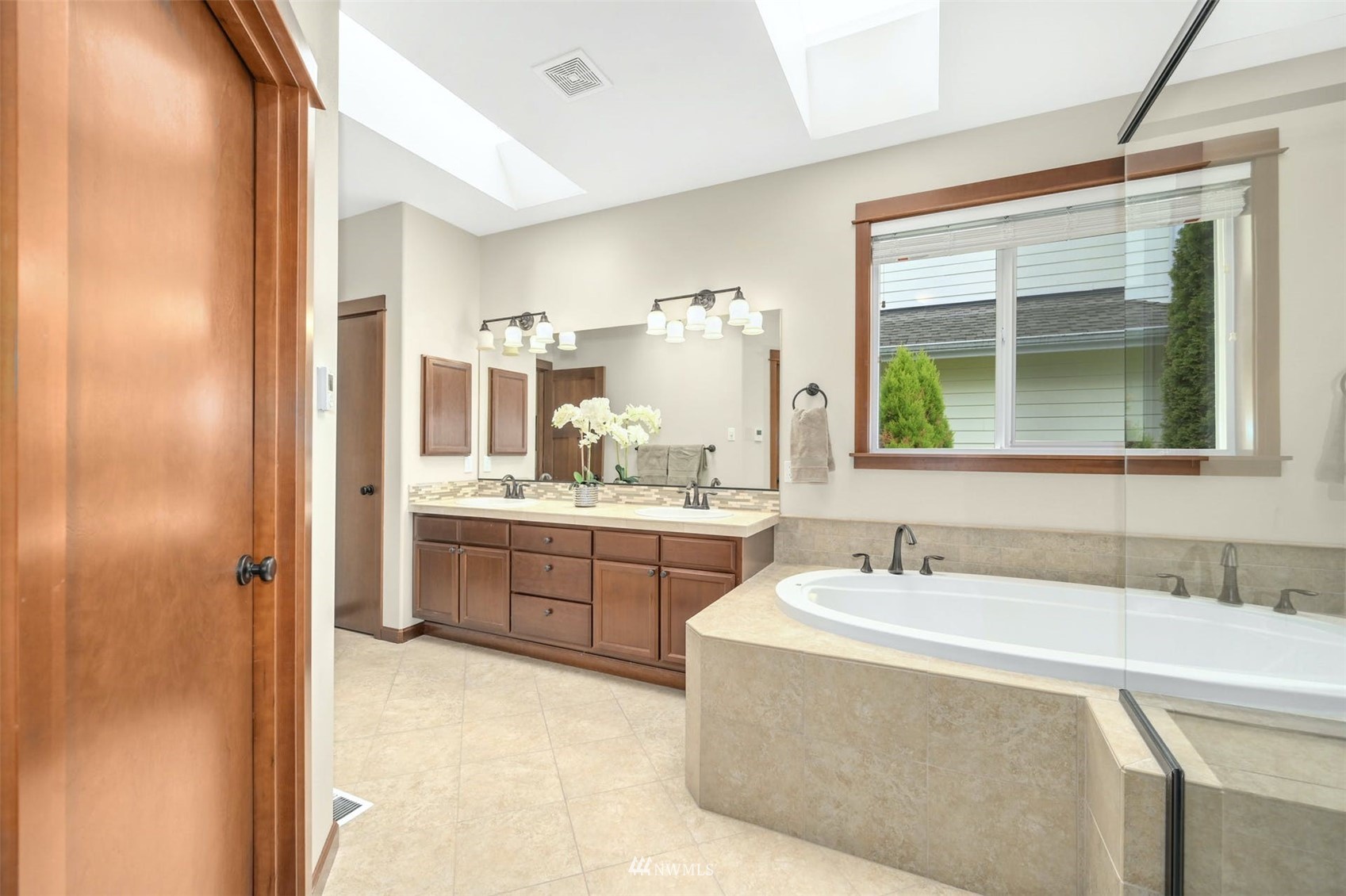 22722 16th Avenue West Bothell, WA 98021 - Photo 18 of 39 a bathroom with a granite countertop sink mirror and a bathtub