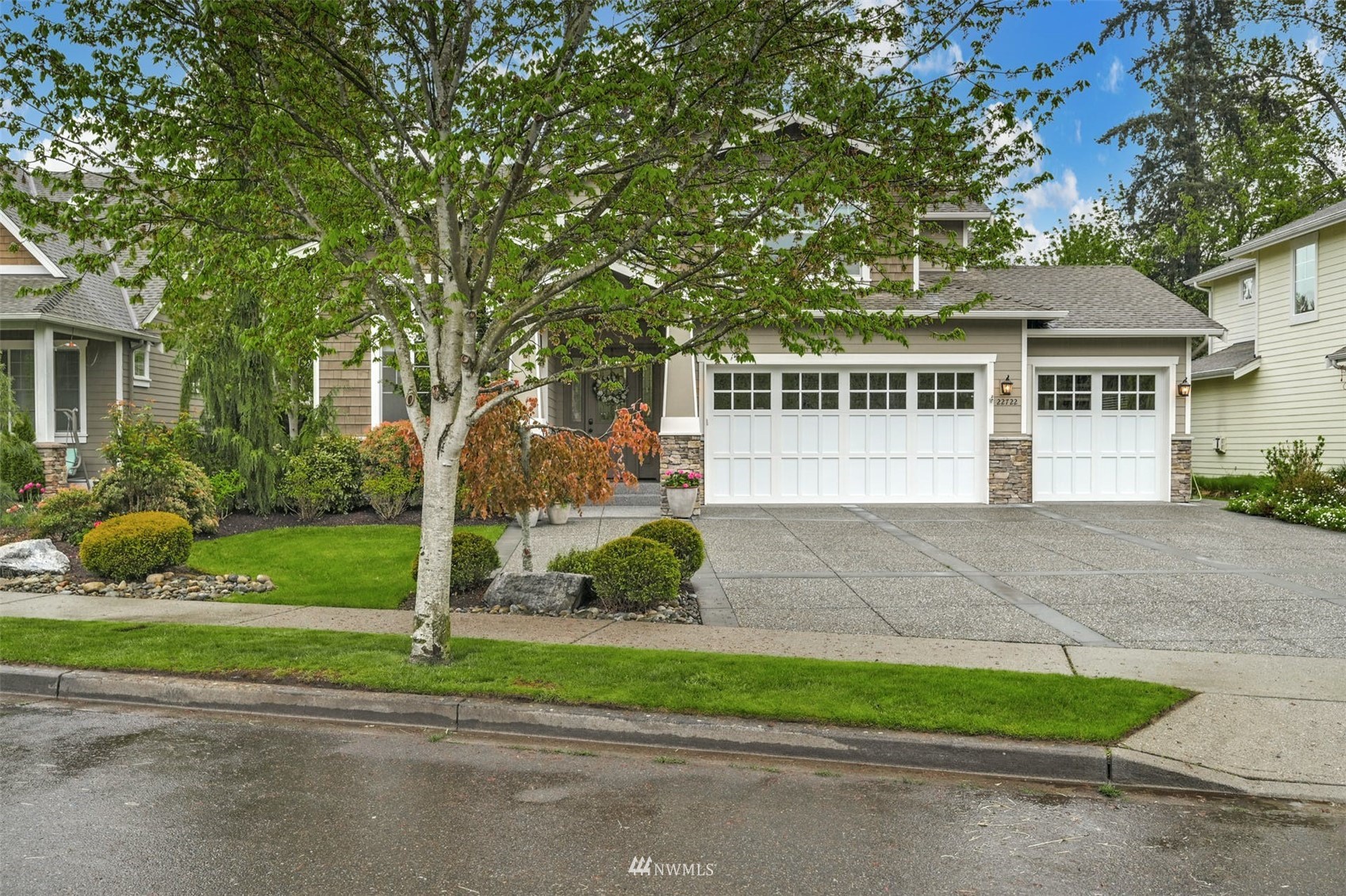 22722 16th Avenue West Bothell, WA 98021 - Photo 2 of 39 a front view of a house with a yard and potted plants