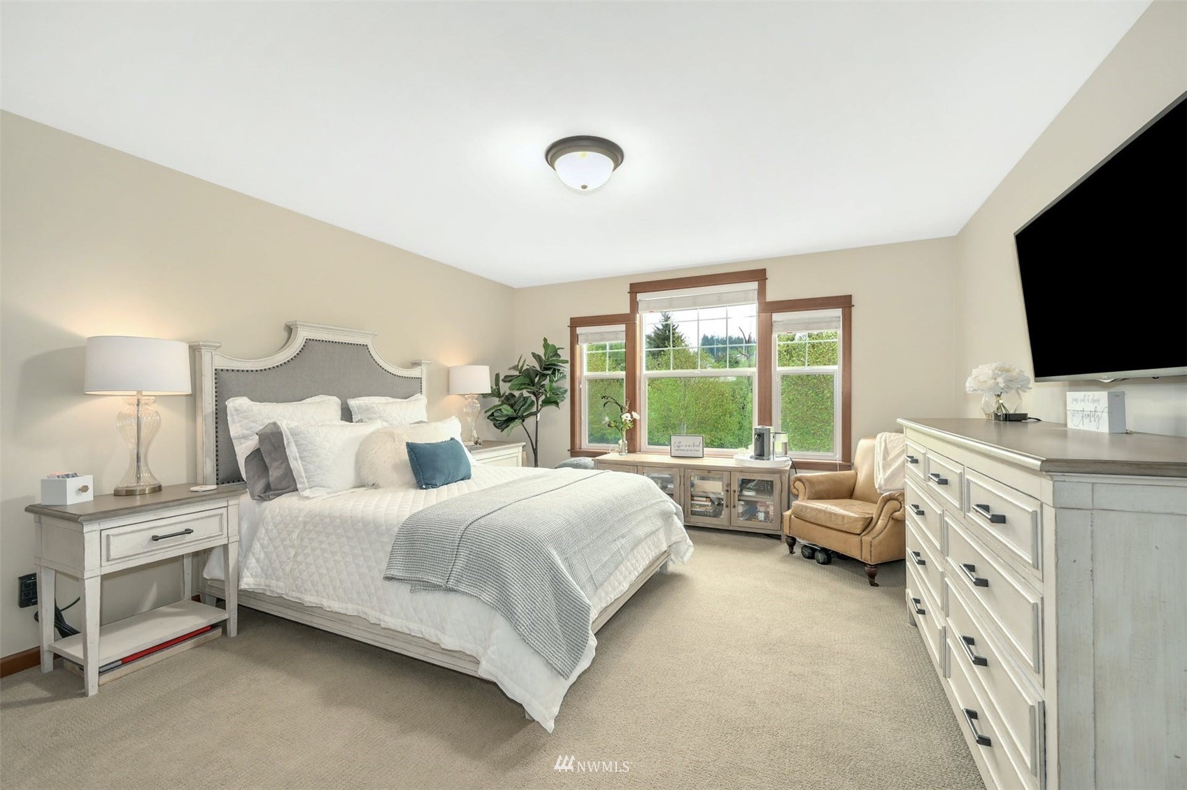 22722 16th Avenue West Bothell, WA 98021 - Photo 24 of 39 a bedroom with a bed and flat screen tv