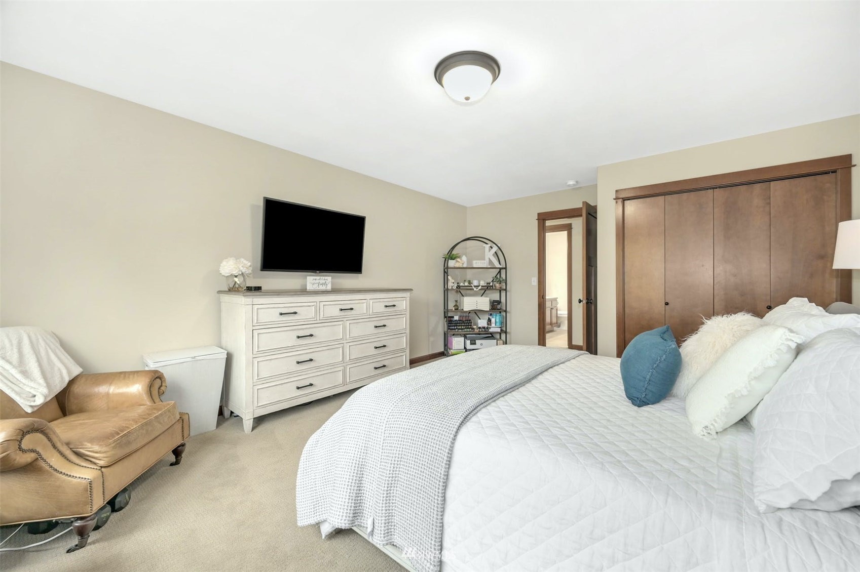 22722 16th Avenue West Bothell, WA 98021 - Photo 25 of 39 a bedroom with furniture and a flat screen tv
