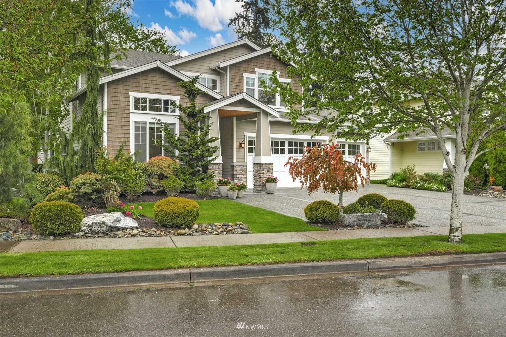 22722 16th Avenue West Bothell, WA 98021 - Photo 3 of 39 a front view of a house with a yard and potted plants
