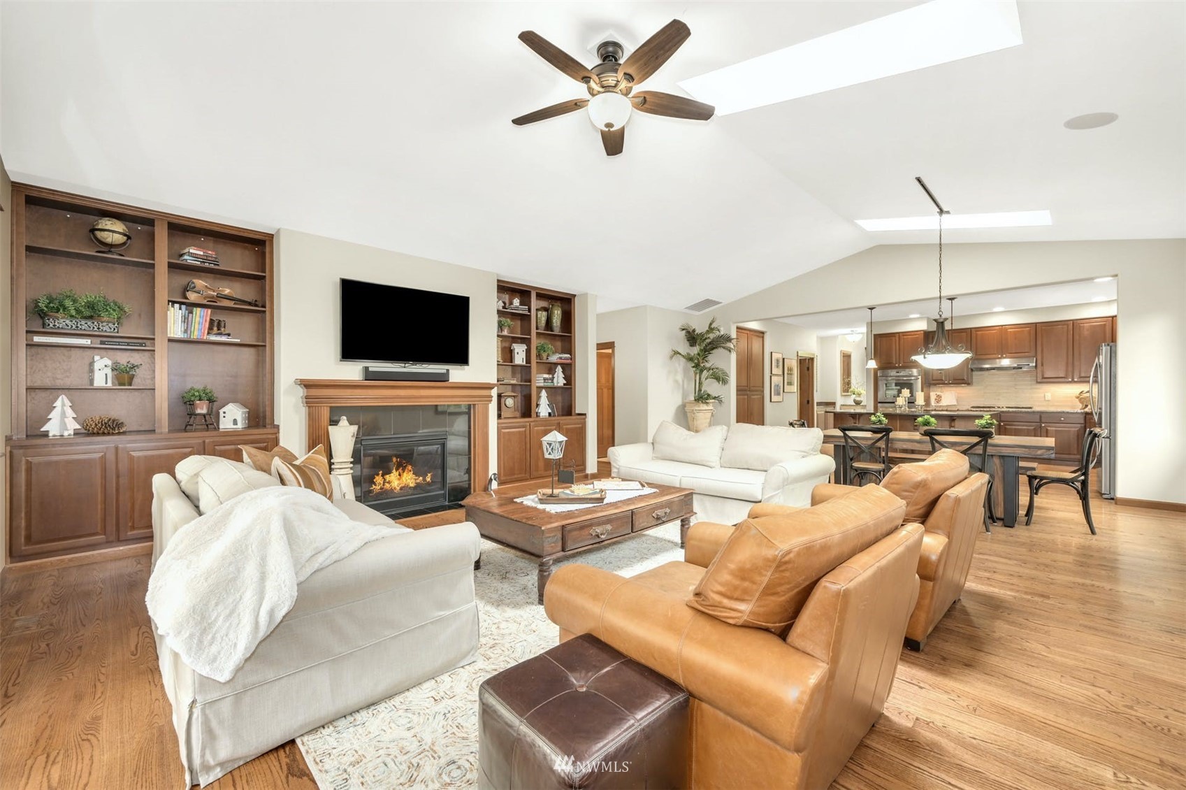 22722 16th Avenue West Bothell, WA 98021 - Photo 8 of 39 a living room with furniture a fireplace and a flat screen tv