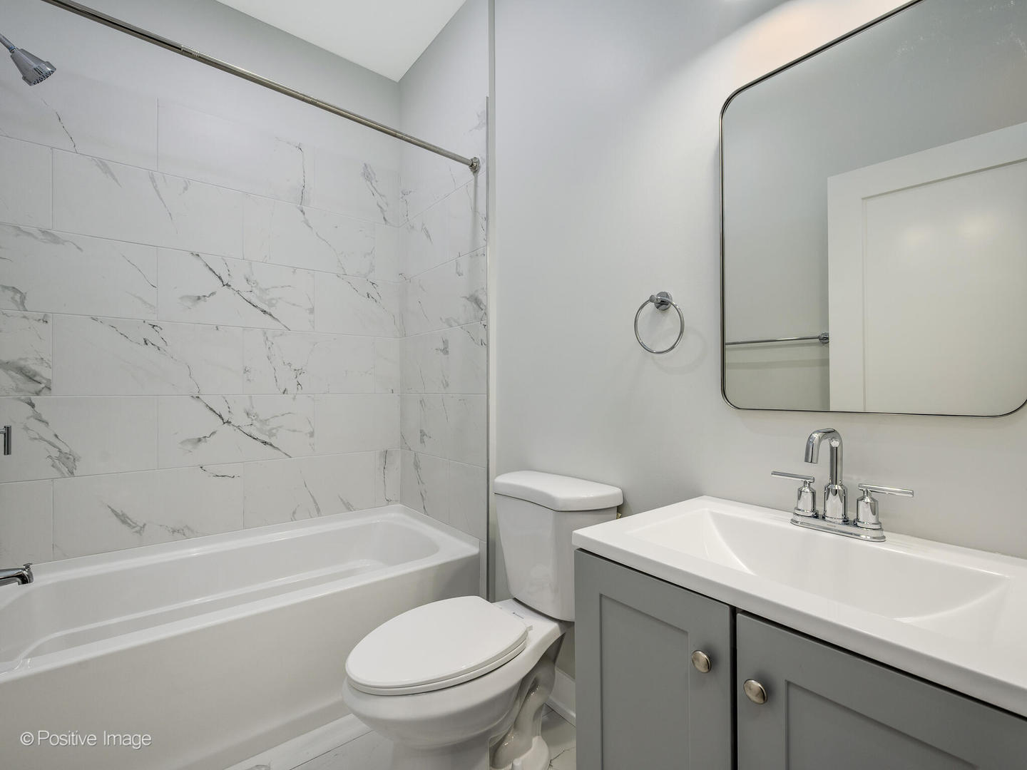 3956 South Indiana Avenue, Unit 1F Chicago, IL 60653 - Photo 8 of 12 a bathroom with a sink toilet and shower