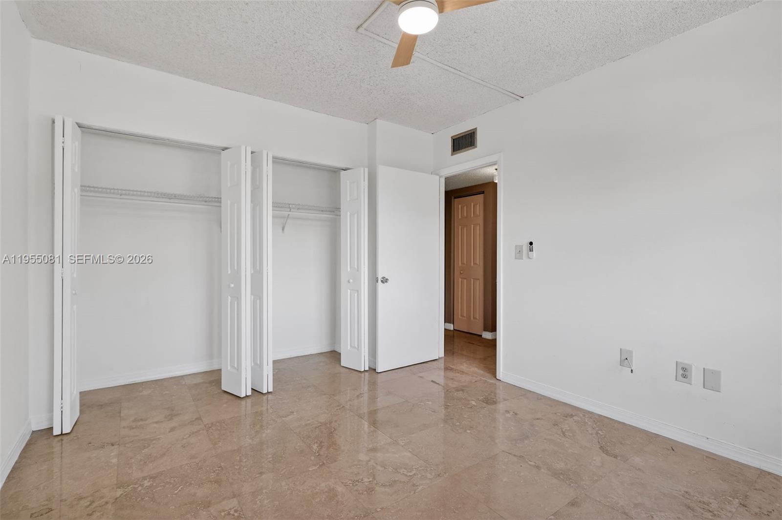 491 Ives Dairy Road, Unit 3065 Miami, FL 33179 - Photo 15 of 41 an empty room with closet area