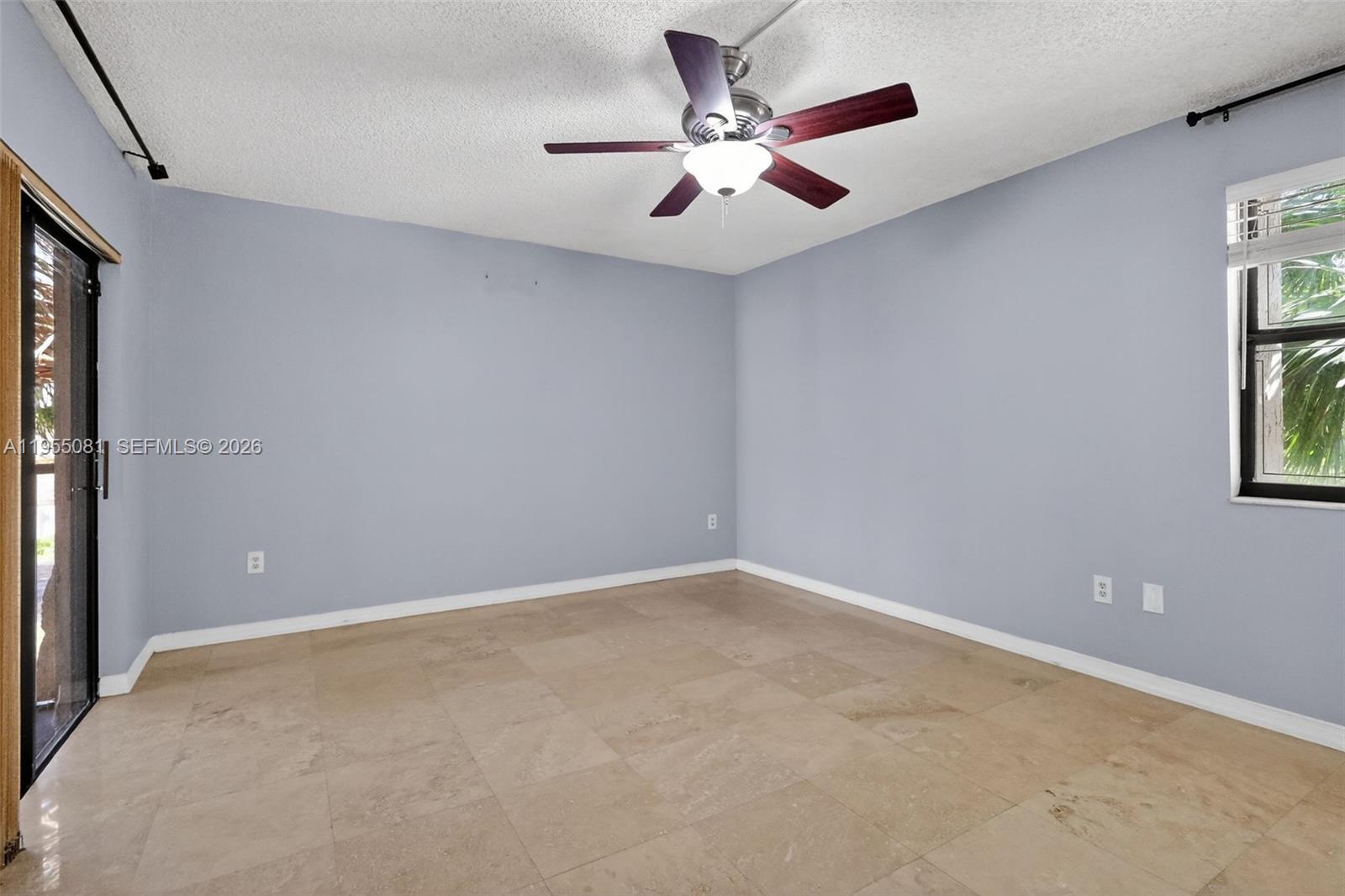 491 Ives Dairy Road, Unit 3065 Miami, FL 33179 - Photo 17 of 41 an empty room with windows and fan