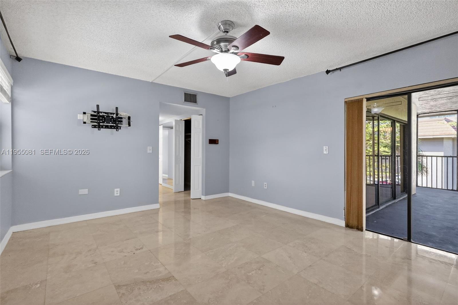 491 Ives Dairy Road, Unit 3065 Miami, FL 33179 - Photo 18 of 41 a view of an empty room with a ceiling fan