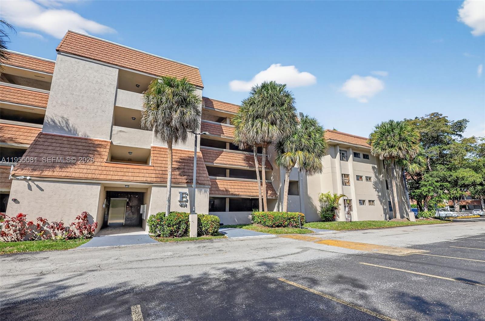 491 Ives Dairy Road, Unit 3065 Miami, FL 33179 - Photo 2 of 41 front view of a brick house with a yard