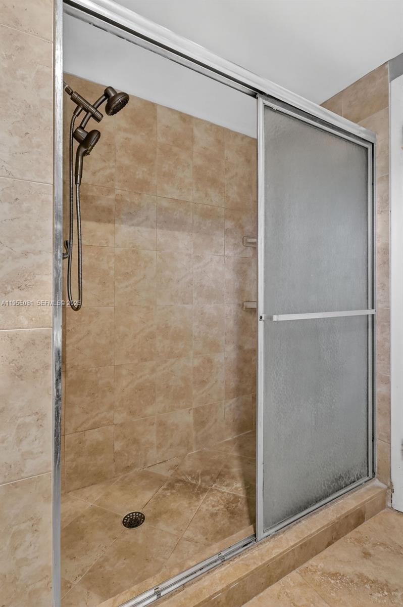 491 Ives Dairy Road, Unit 3065 Miami, FL 33179 - Photo 26 of 41 a bathroom with a glass shower door