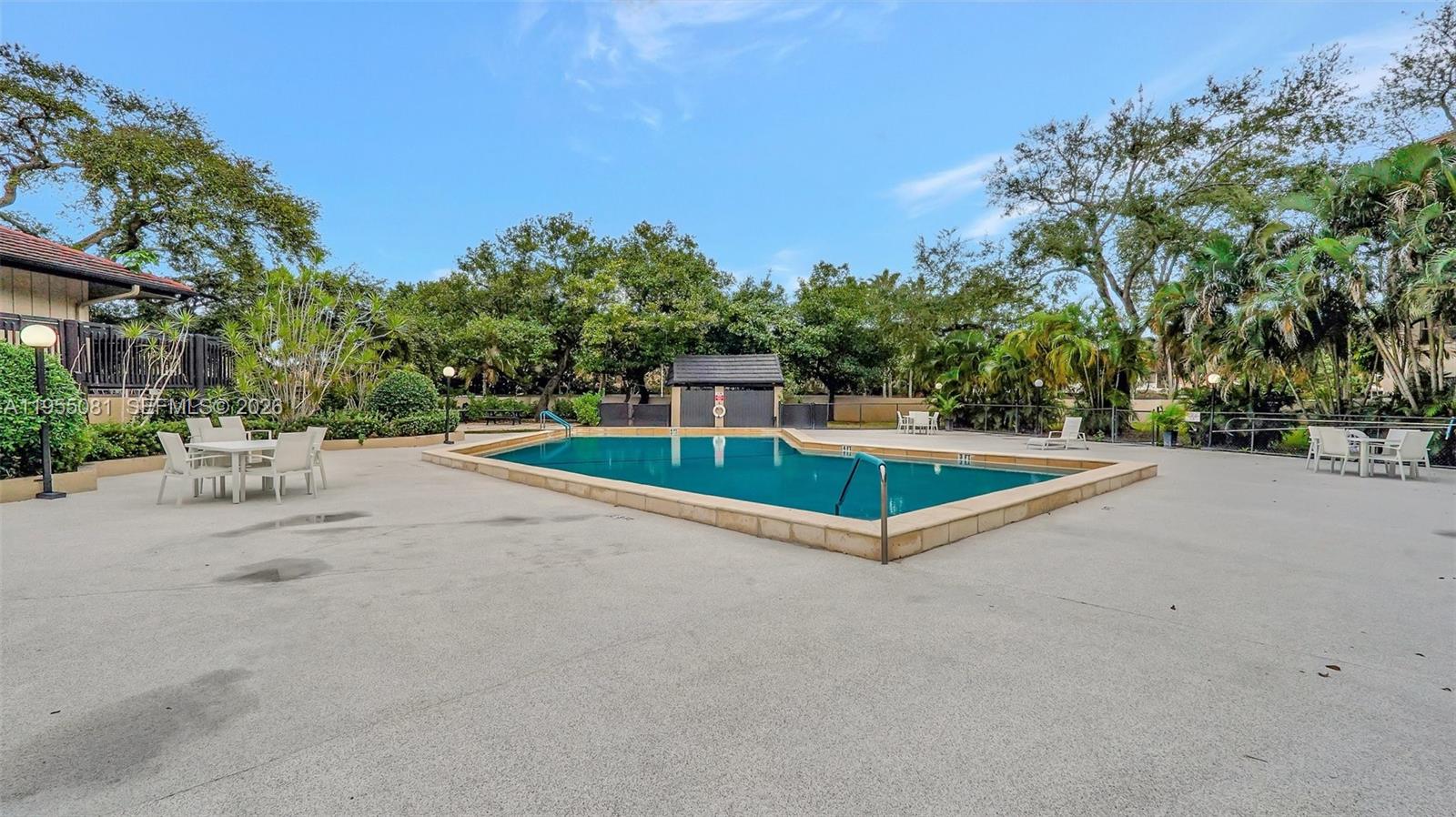 491 Ives Dairy Road, Unit 3065 Miami, FL 33179 - Photo 36 of 41 a view of a swimming pool with a yard