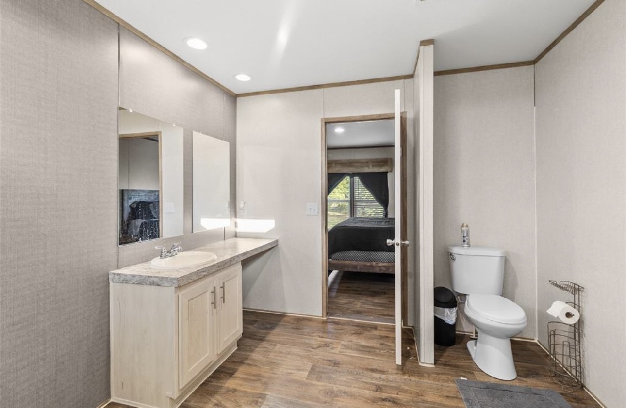 43 Ironwood Road Victoria, TX 77904 - Photo 13 of 21 a spacious bathroom with a toilet sink and mirror