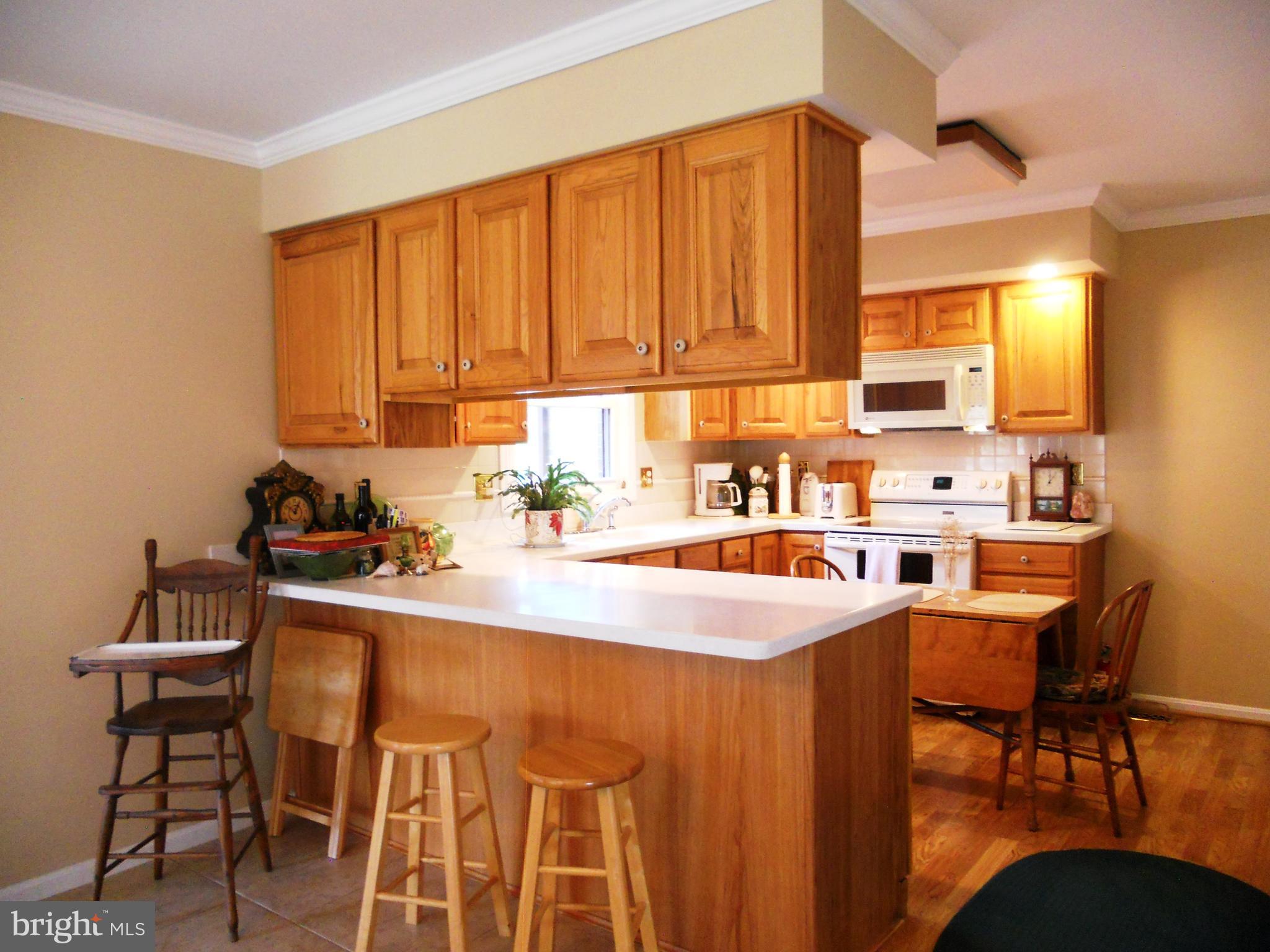 1188 Long Valley Road Westminster, MD 21158 - Photo 8 of 37 Kitchen with breakfast bar, corian countertops