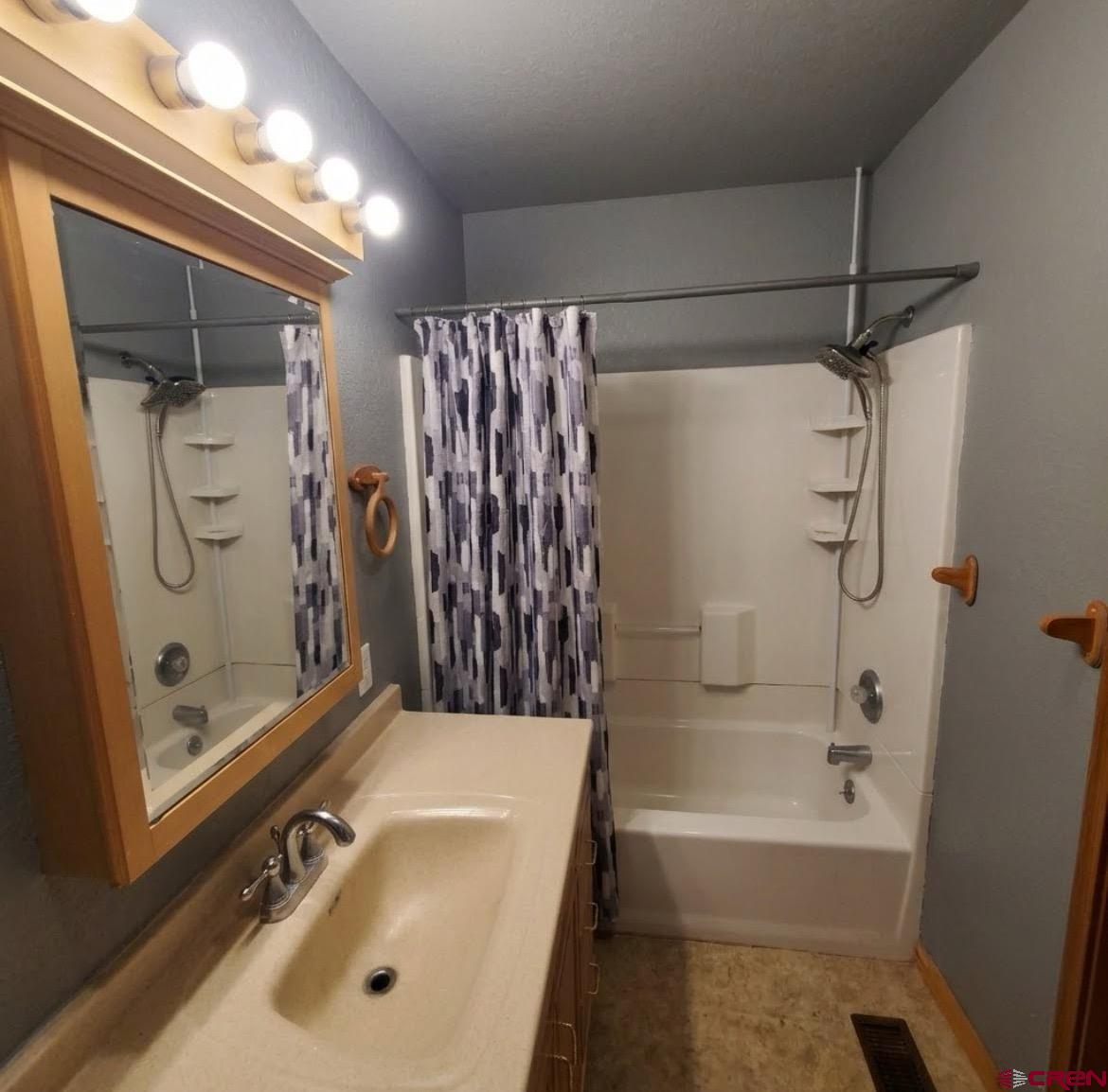 816 Main Street Manassa, CO 81141 - Photo 19 of 23 a bathroom with a tub a sink and a shower