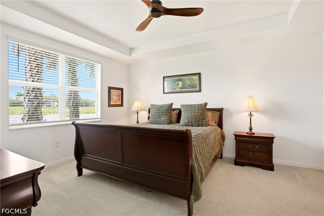 3751 Pebblebrook Ridge Court, Unit 101 Fort Myers, FL 33905 - Photo 19 of 48 a spacious bedroom with a bed and a window