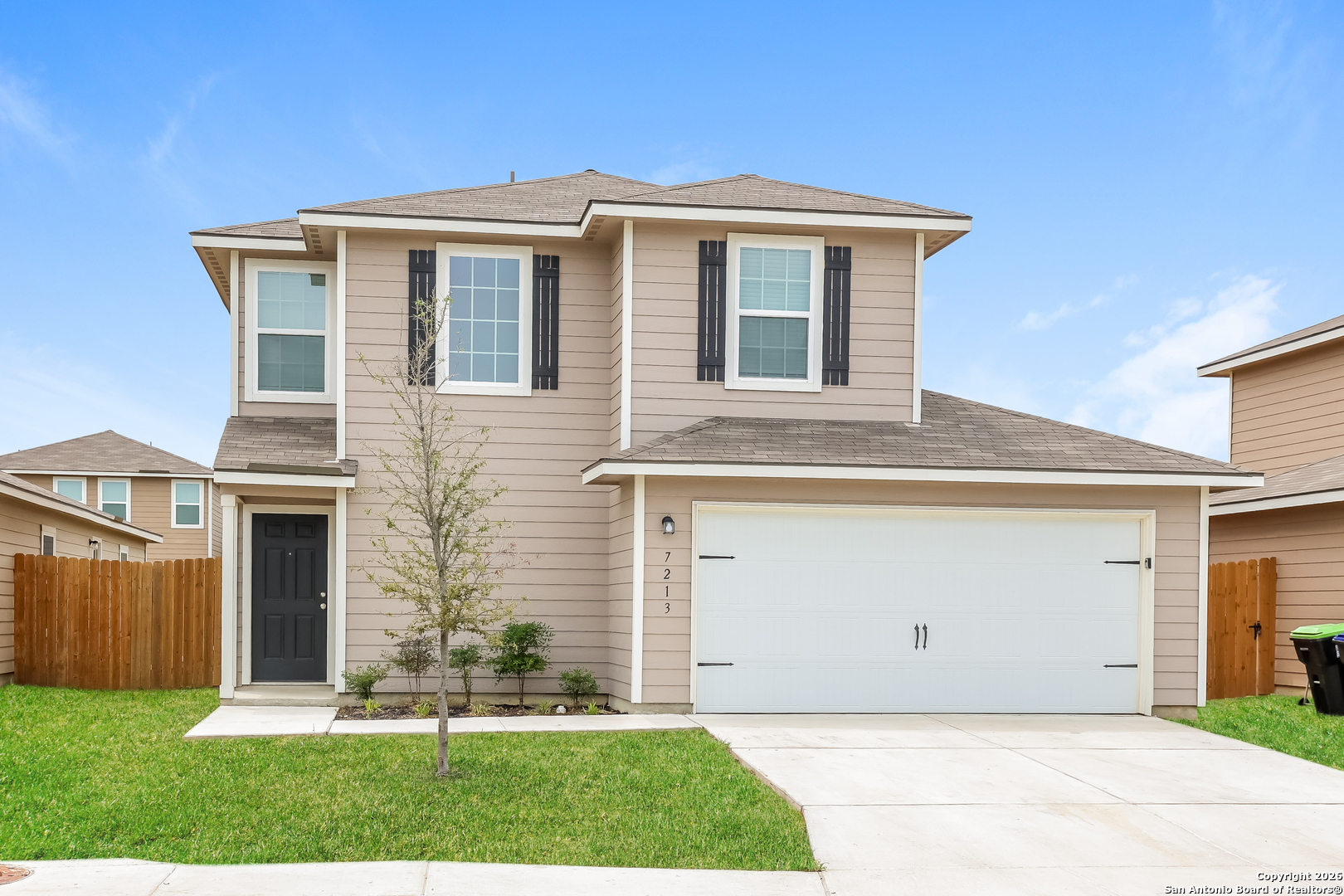 a front view of a house with a yard
