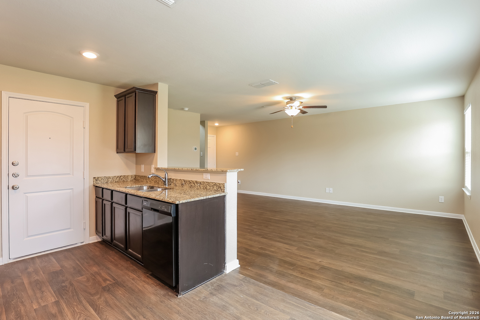 7213 Romaire San Antonio, TX 78252 - Photo 5 of 15 a kitchen with a stove and a wooden floors