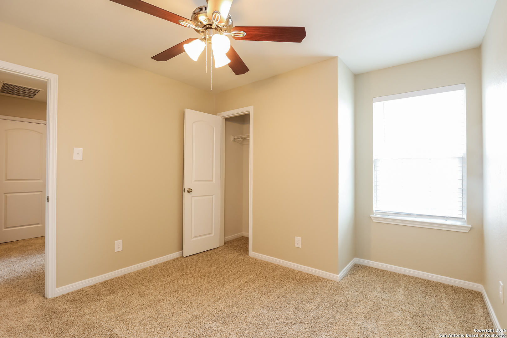 7213 Romaire San Antonio, TX 78252 - Photo 10 of 15 an empty room with windows and fan