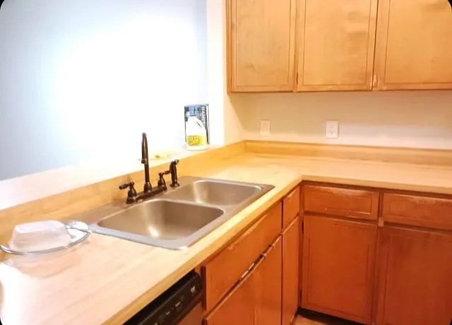 a kitchen with a sink and a cabinets