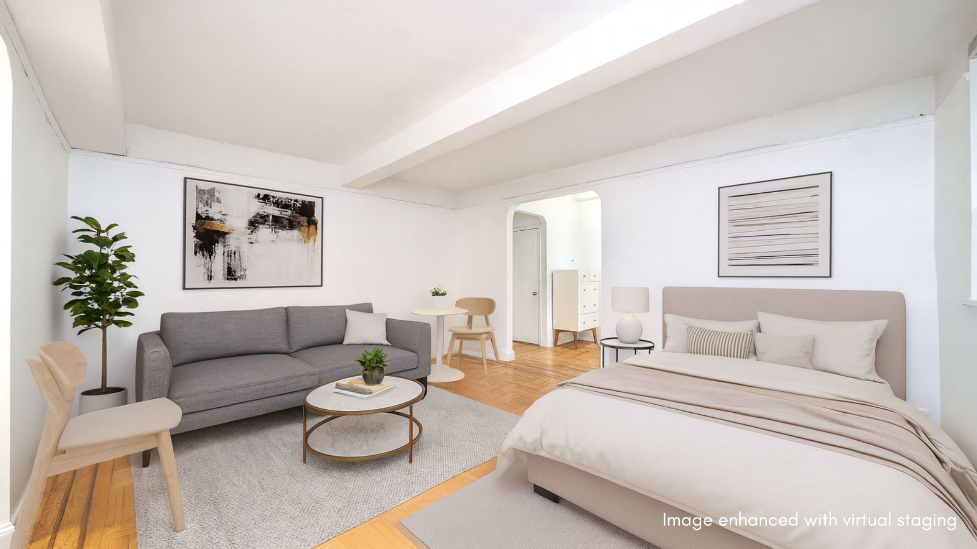 a bedroom with furniture and a large window