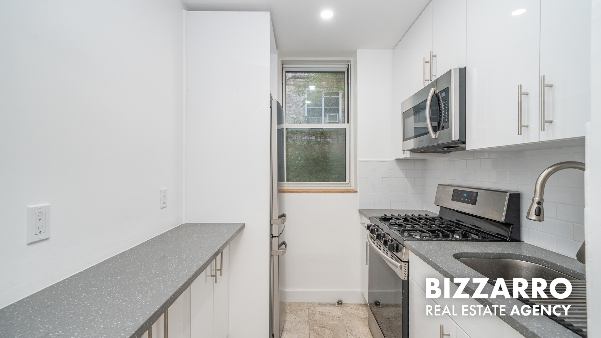 360 Cabrini Boulevard, Unit 3I Manhattan, NY 10040 - Photo 6 of 11 a kitchen with granite countertop a stove and a sink