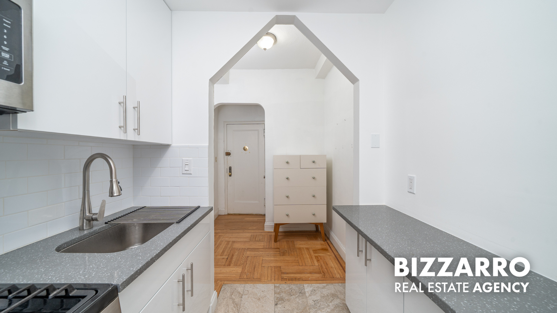 360 Cabrini Boulevard, Unit 3I Manhattan, NY 10040 - Photo 7 of 11 a kitchen with refrigerator and cabinets