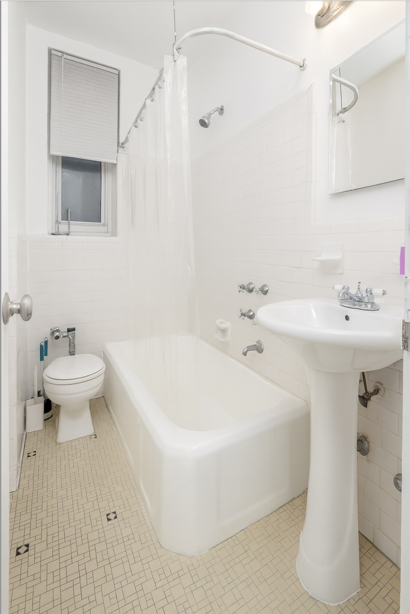 360 Cabrini Boulevard, Unit 3I Manhattan, NY 10040 - Photo 8 of 11 a white bath tub sitting next to a white sink